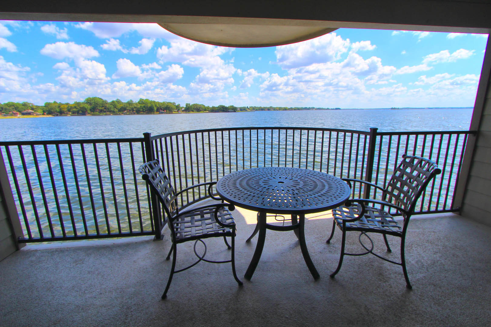 A peaceful balcony view to the lake at VRI's The Landing at Seven Coves in Willis, Texas.